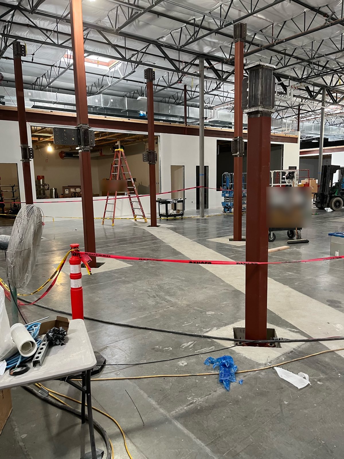 Installed steel columns with bolted beam connection plates